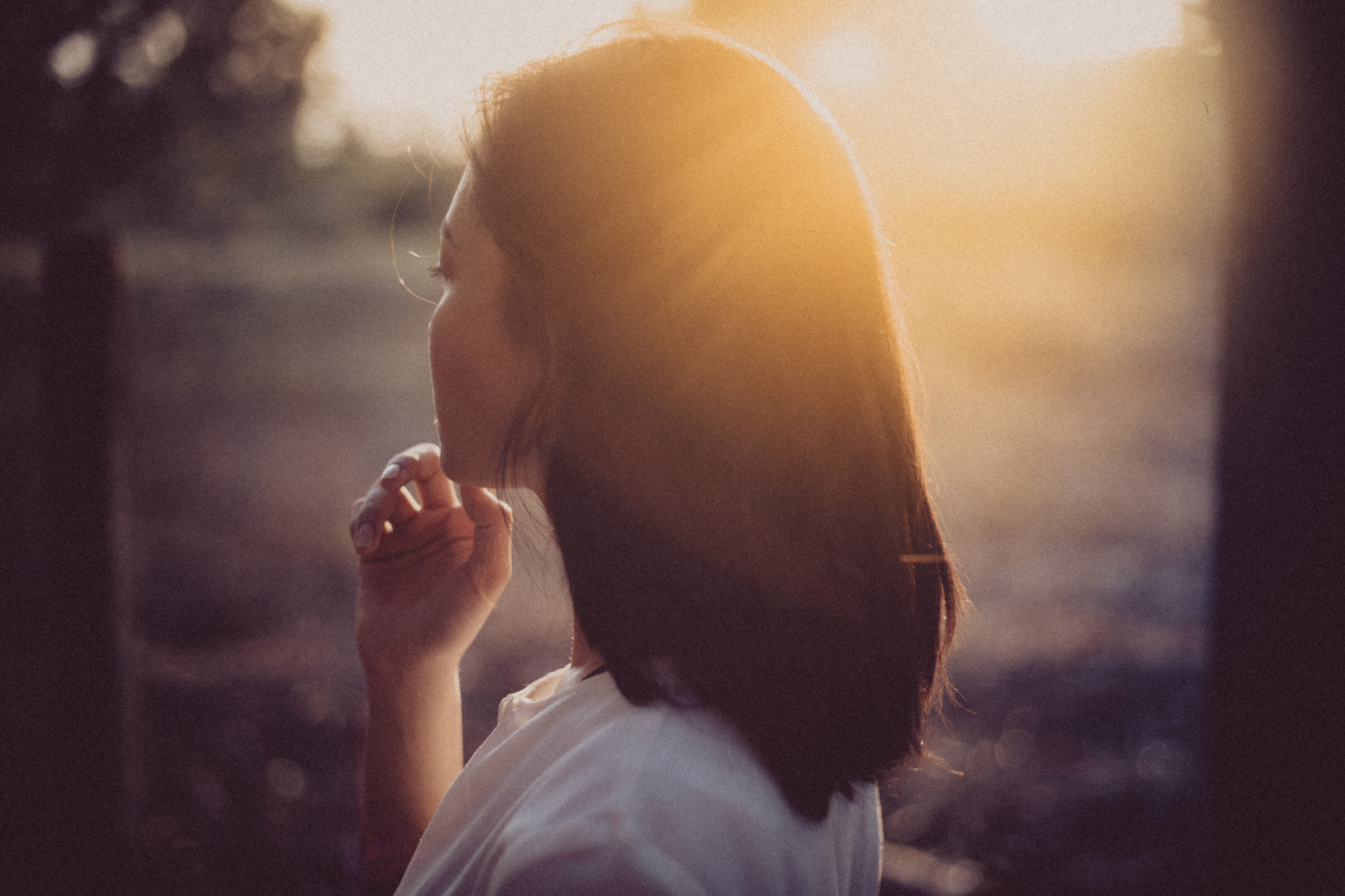 A calm woman standing in her new identity while the old reality fades behind her