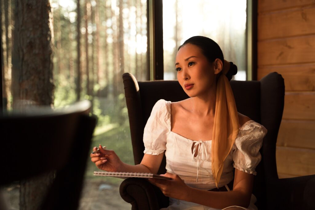 Woman journaling while listening to her inner voice